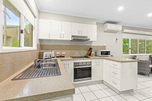 Apartment, 2 Bedrooms | Private kitchen | Fridge, microwave, stovetop, coffee/tea maker