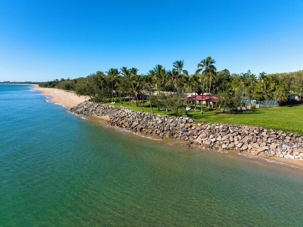 On the beach, sun-loungers, beach towels, fishing