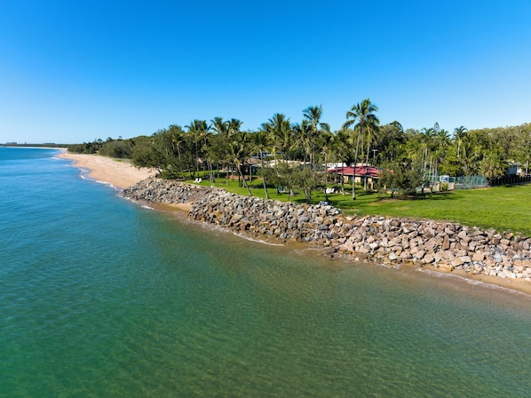 On the beach, sun-loungers, beach towels, fishing