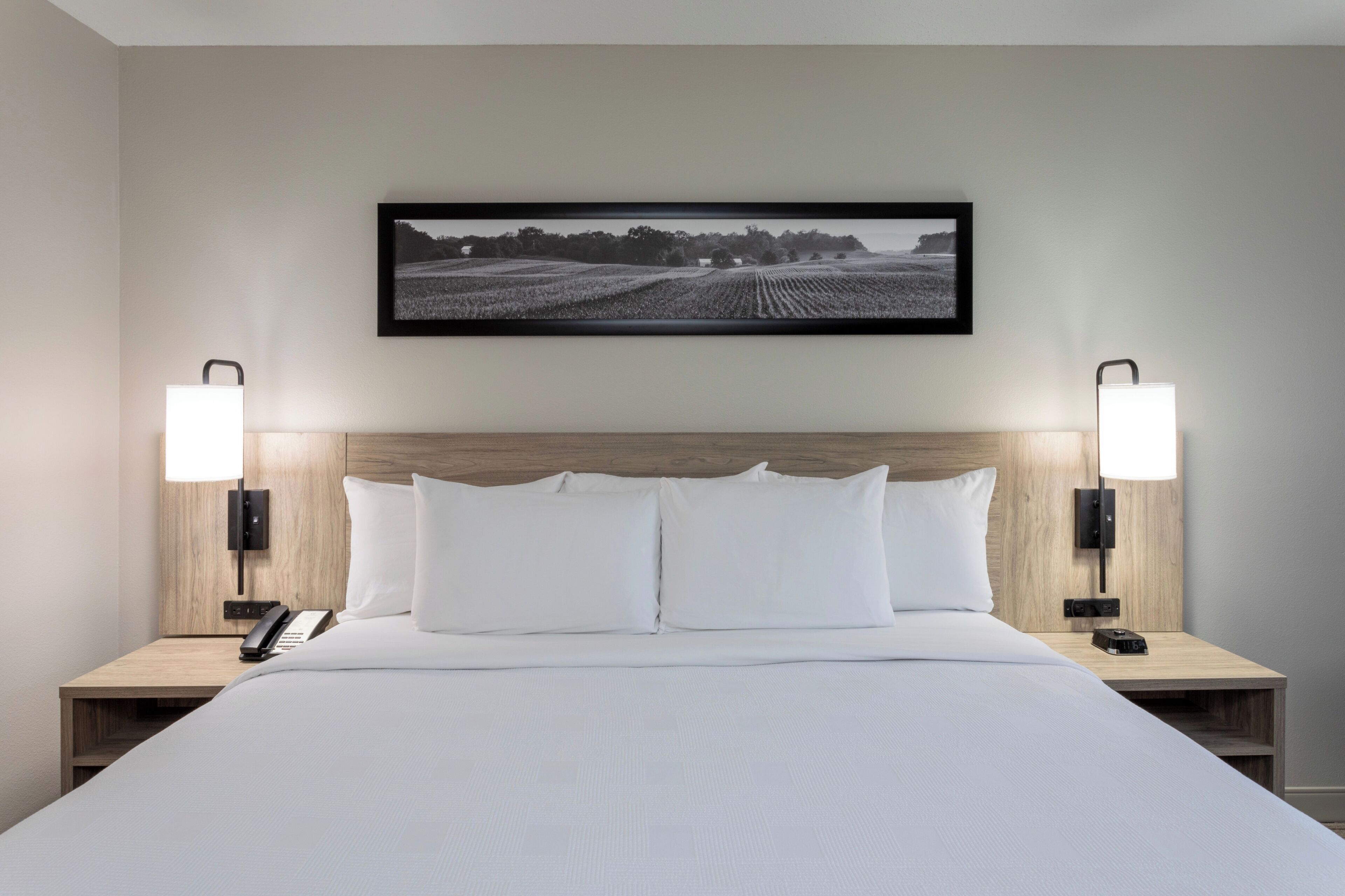 Premium bedding, desk, laptop workspace, blackout curtains