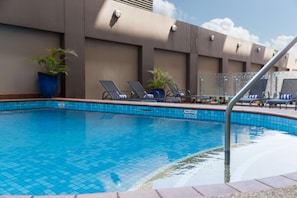 Outdoor pool, open 6:00 AM to 8:00 PM, pool loungers