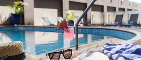 Outdoor pool, open 6:00 AM to 8:00 PM, sun loungers