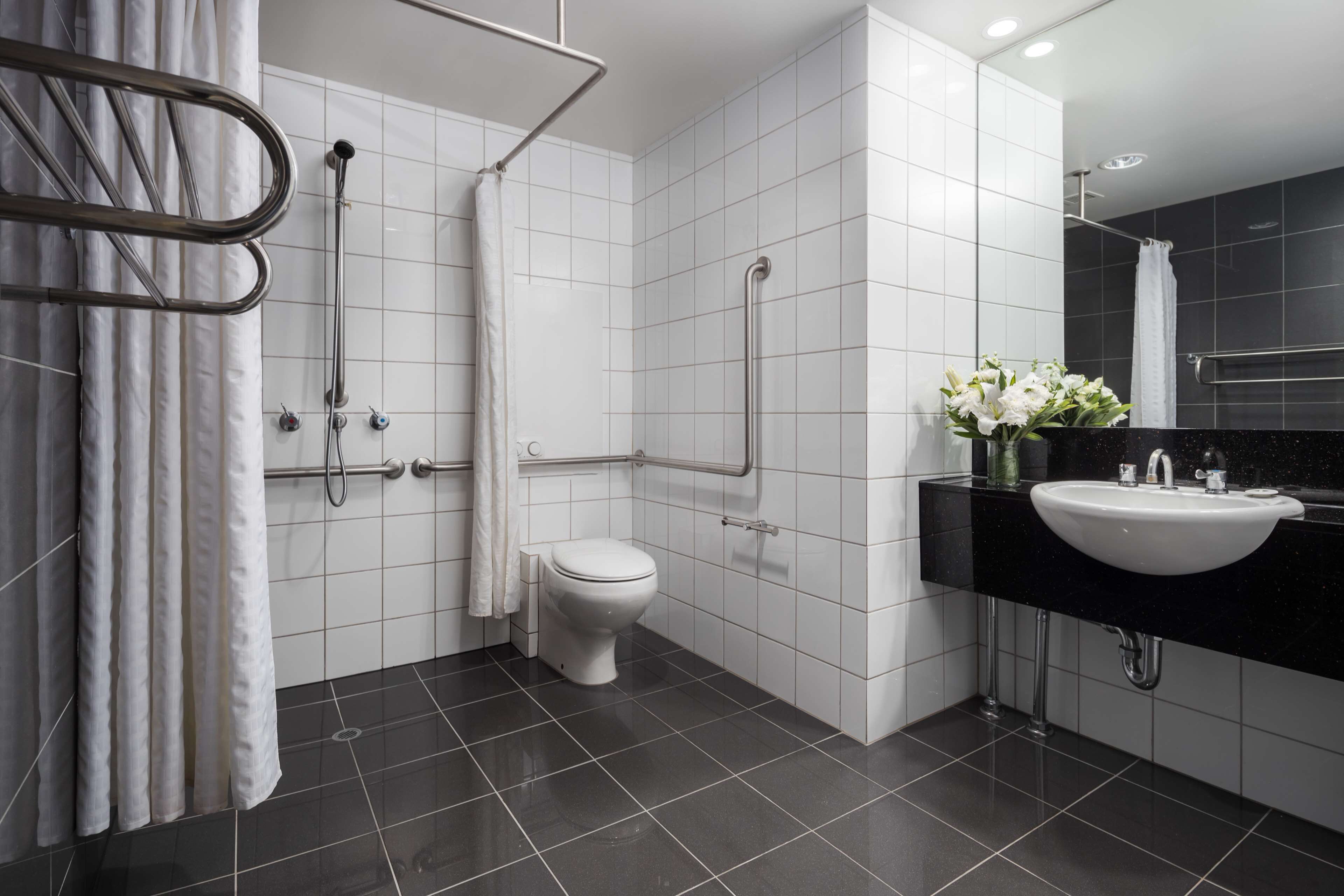 deluxe room, 1 king bed | bathroom | shower, free toiletries, hair dryer, towels