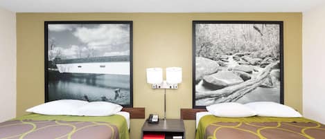 A hotel room with two beds, a nightstand with a phone, and two wall-mounted lamps.