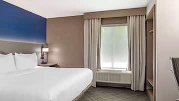 Suite, 1 King Bed with Sofa bed, Non Smoking | Desk, laptop workspace, blackout curtains, iron/ironing board
