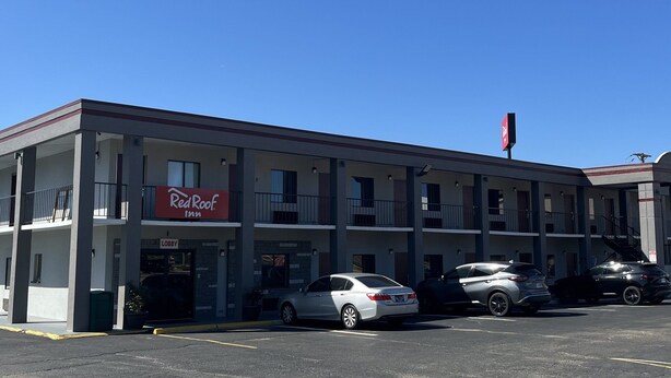 A Red Roof Inn with a two-story structure, a covered parking area, and a visible entrance. - Red Roof Inn Kimball, TN - I-24 (Jasper)