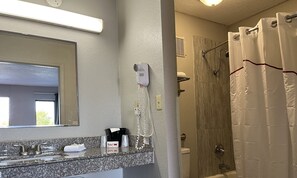 Deluxe Room, 2 Queen Beds, Non Smoking | Bathroom | Hair dryer, towels, soap, shampoo