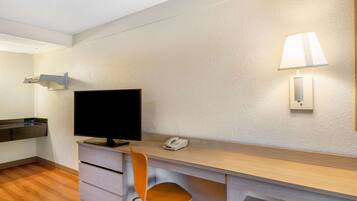 Desk, laptop workspace, blackout drapes, free cribs/infant beds