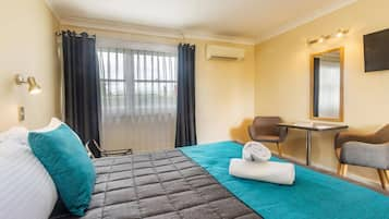 Deluxe Room, 1 Queen Bed | Desk, iron/ironing board, free WiFi, bed sheets