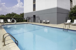Outdoor pool, open 6 AM to 10 PM, pool loungers
