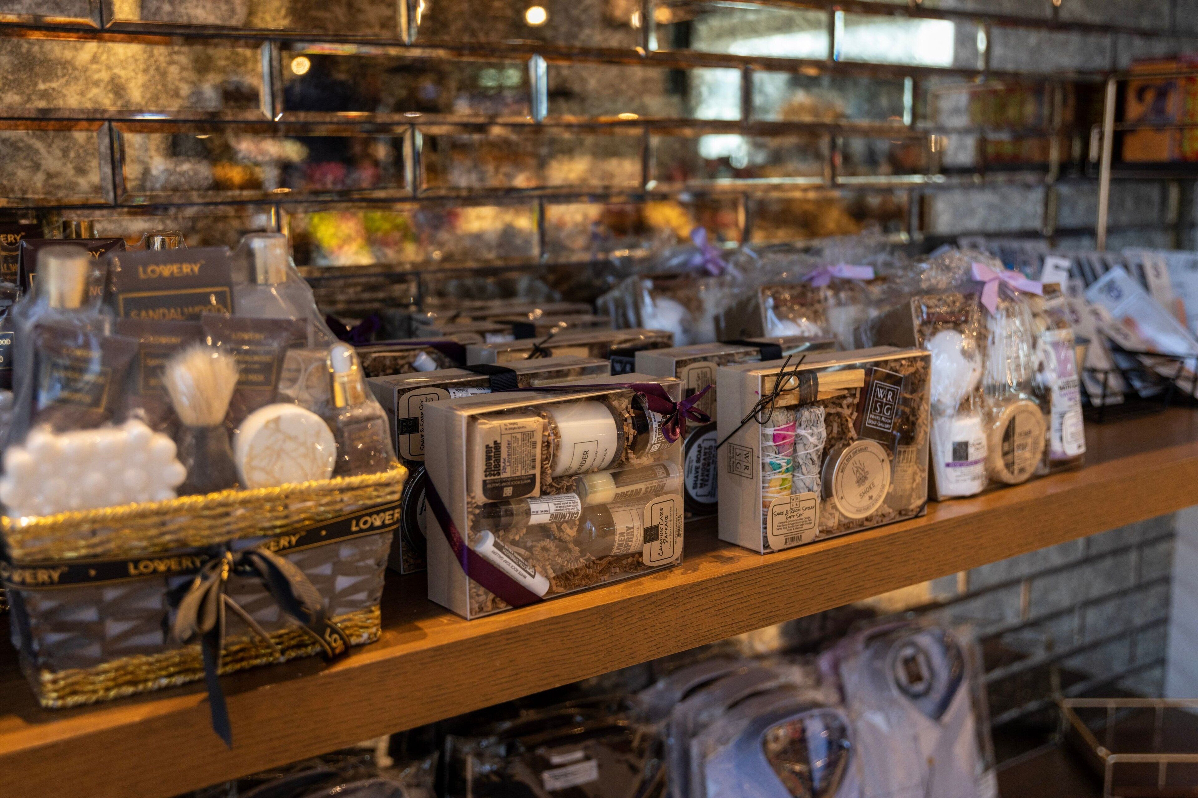 A shelf with various packaged items, including boxes and bottles, likely containing toiletries or personal care products.