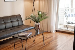 Premier Suite | Living area | 32-inch LCD TV with cable channels