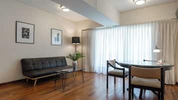 Premier Suite | Living area | 32-inch LCD TV with cable channels