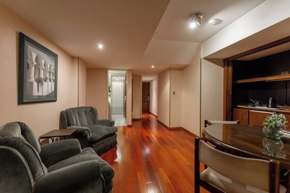 Premier Suite Superior | Living area | 32-inch LCD TV with cable channels