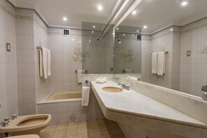 Combined shower/tub, deep soaking tub, hair dryer, bidet