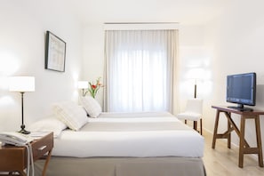 Ropa de cama de alta calidad, colchones con acolchado adicional, minibar