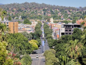 Stunning town center with a prominent clock tower, surrounded by a mix of homes and shops.
