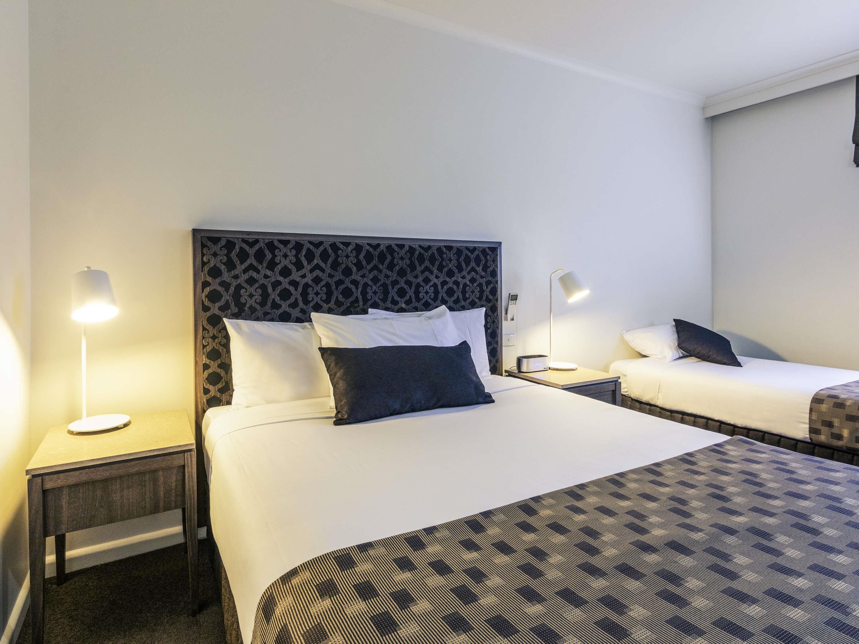 Superior Room, Multiple Beds | Minibar, desk, laptop workspace, iron/ironing board