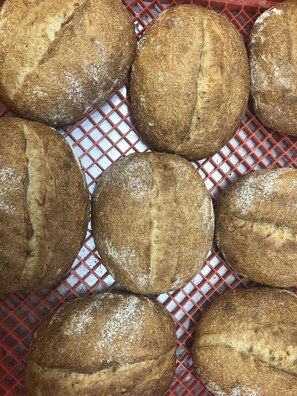 A tray of freshly baked bread loaves. - Mercure Albury (Albury)