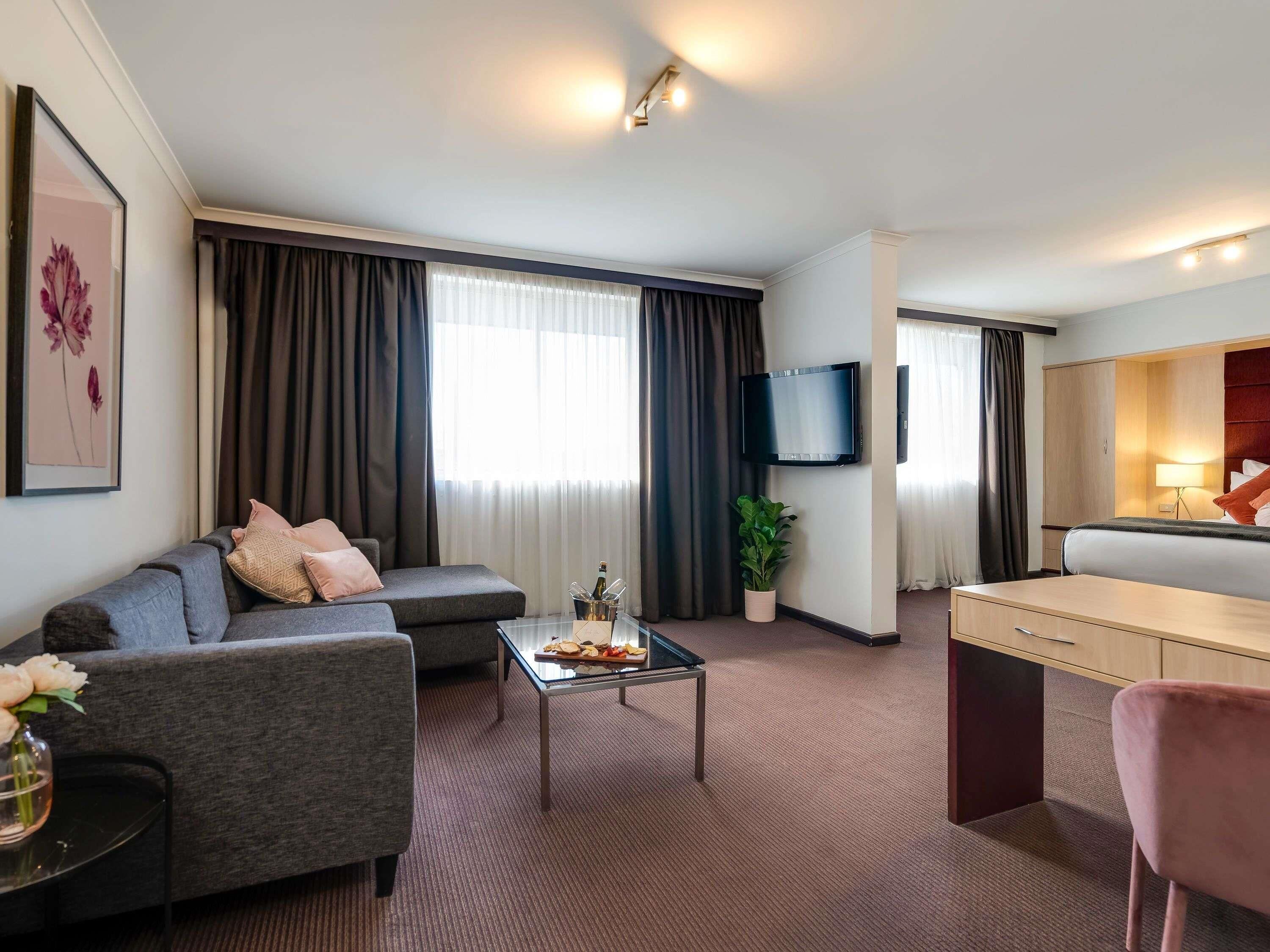 Deluxe Suite, 1 King Bed | Minibar, desk, laptop workspace, iron/ironing board