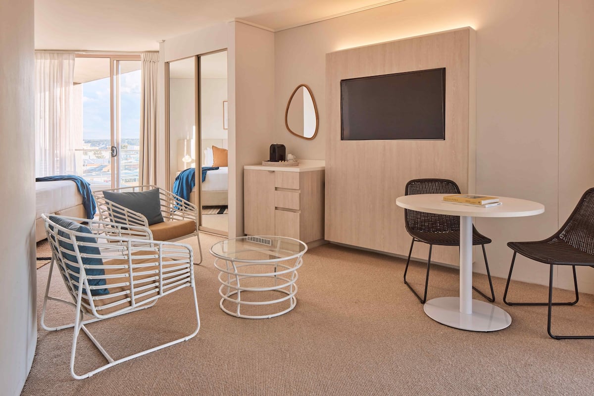 Standard Room | Living area | 32-inch LCD TV with cable channels, TV