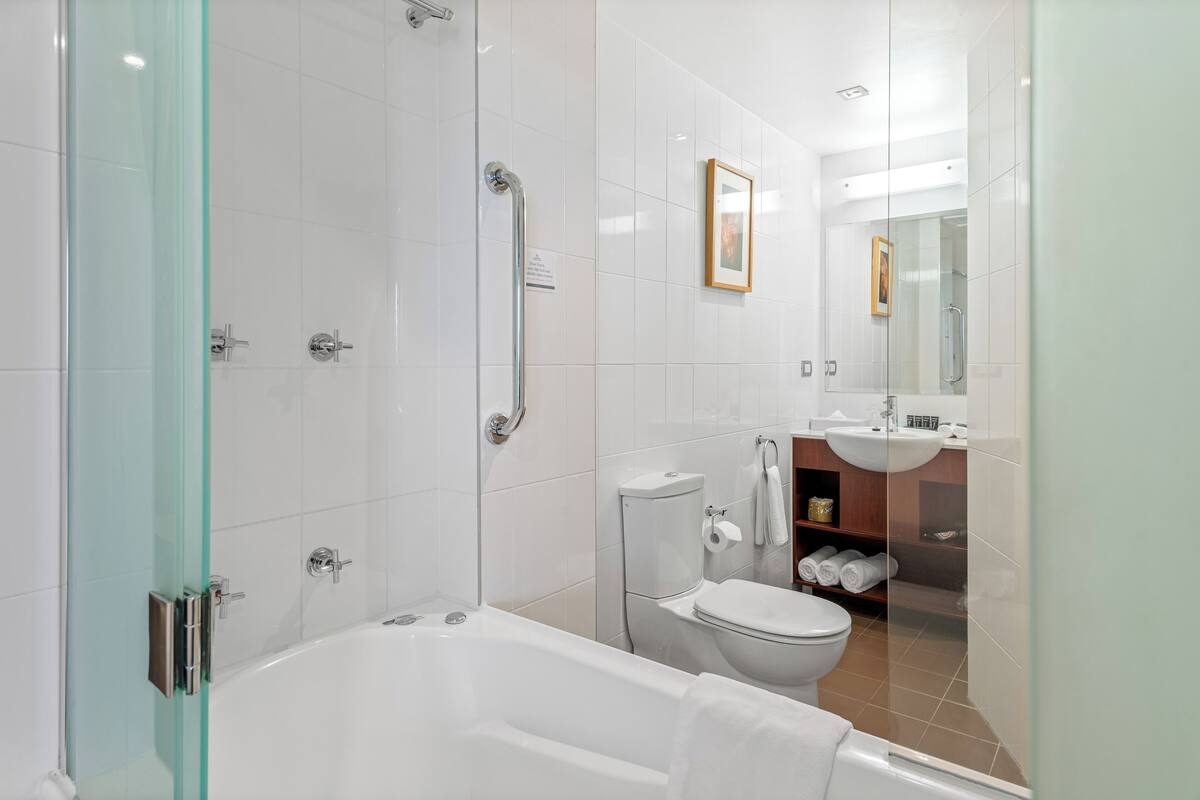 king room with spa bath & balcony | bathroom | designer toiletries, hair dryer, bathrobes, towels