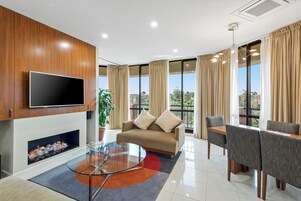 Premium Penthouse | Living area | 40-inch LCD TV with satellite channels, TV, iPod dock