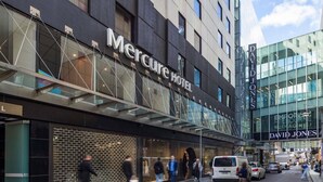 A modern hotel building with a prominent sign for 'Mercure Hotel' and 'David Jones' store. - Mercure Melbourne City Centre (Melbourne)