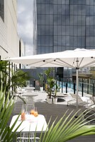 Outdoor pool, open 6:00 AM to 6:00 PM, pool loungers