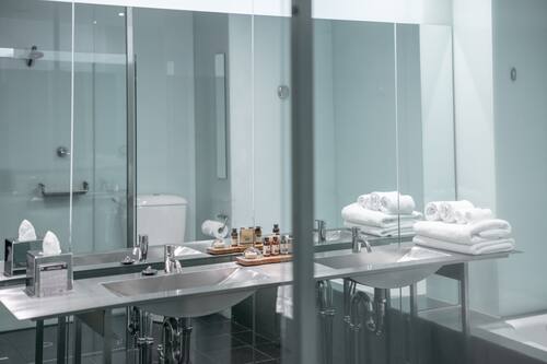Shower, rainfall showerhead, designer toiletries, hair dryer