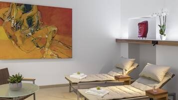 Relax in a serene space with two reclining massage chairs and a calming atmosphere.