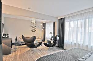 Deluxe Double Room, Kitchenette | Living area | 24-inch TV with cable channels
