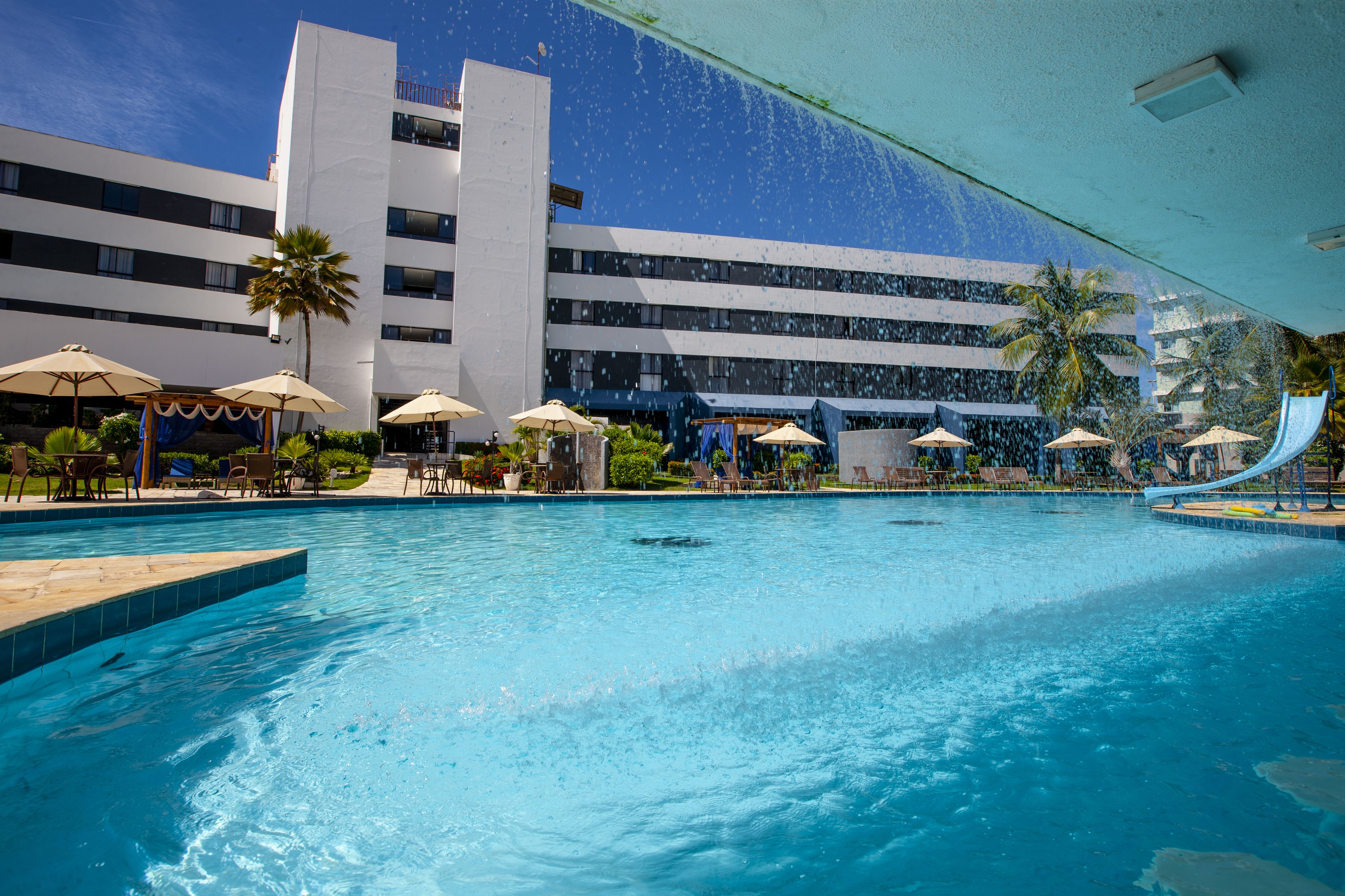 outdoor pool, open 8 am to 8 pm, pool umbrellas, pool loungers