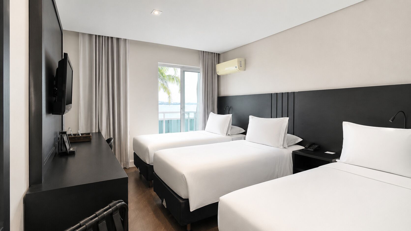 Deluxe Triple Room, 3 Twin Beds | In-room safe, desk, laptop workspace, iron/ironing board