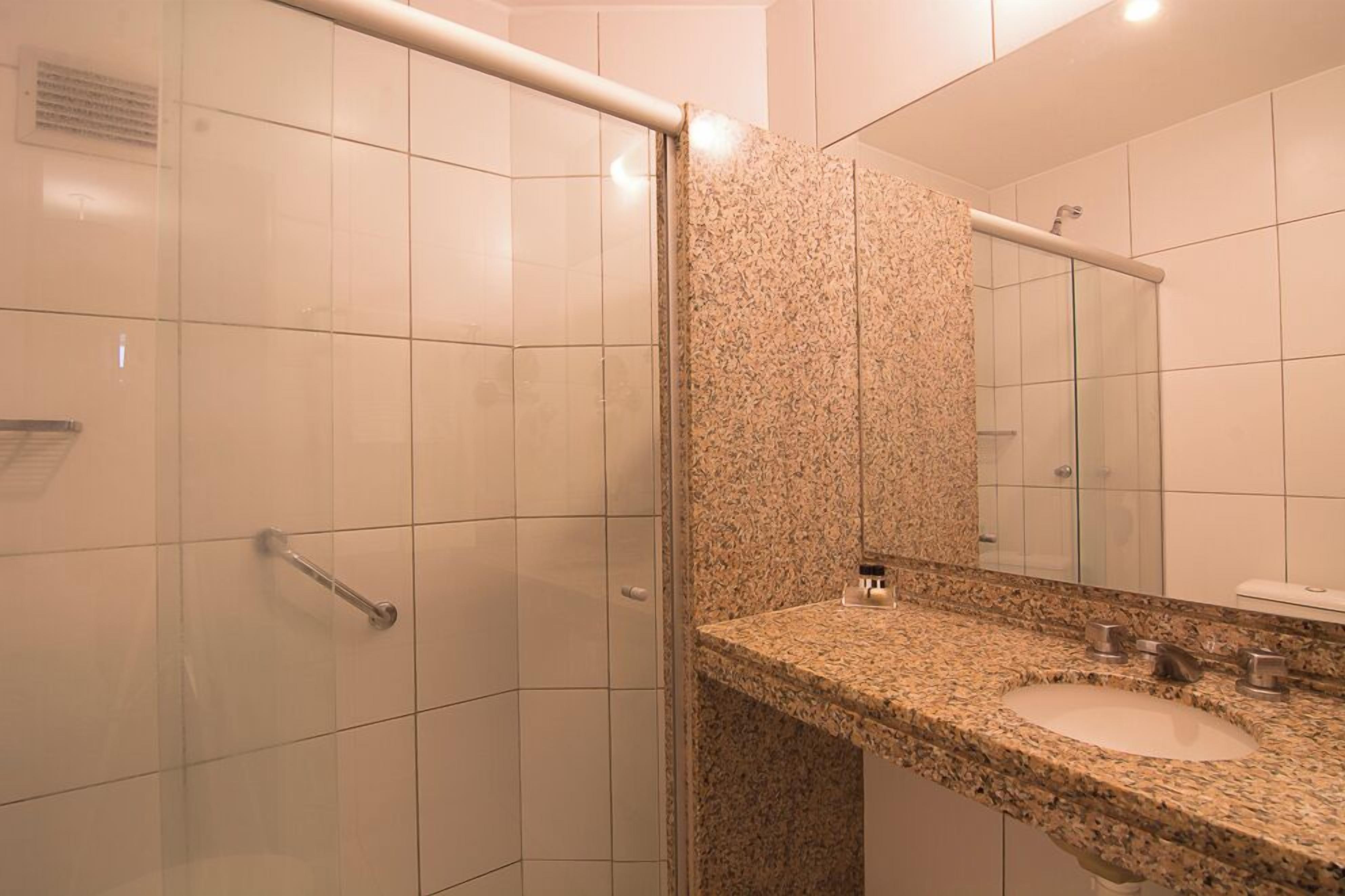 premium suite | bathroom | shower, free toiletries, hair dryer, towels