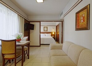Premium Double Room | Living area | 26-inch LCD TV with cable channels, TV