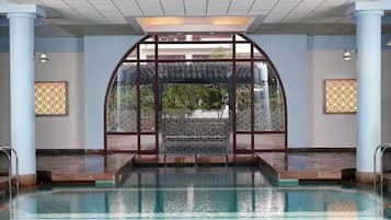 Indoor pool, seasonal outdoor pool, pool umbrellas, pool loungers