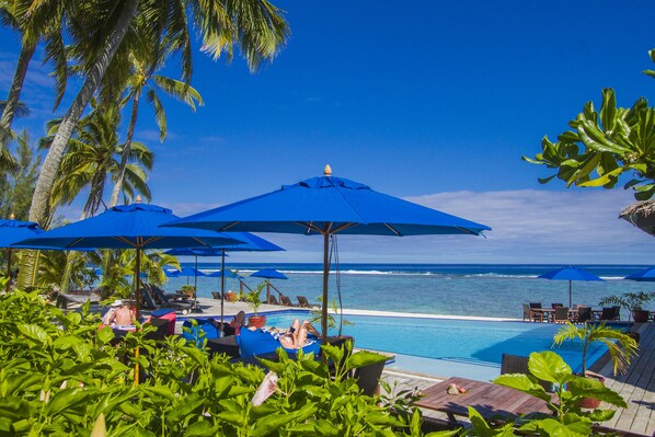 Outdoor pool, pool umbrellas, sun loungers