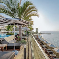 On the beach, sun-loungers, beach umbrellas, beach towels