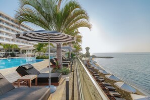 On the beach, sun-loungers, beach umbrellas, beach towels