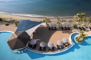 Indoor pool, outdoor pool, pool umbrellas, pool loungers