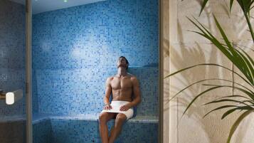 Guests can relax in this serene room with a potted plant and a bathtub.