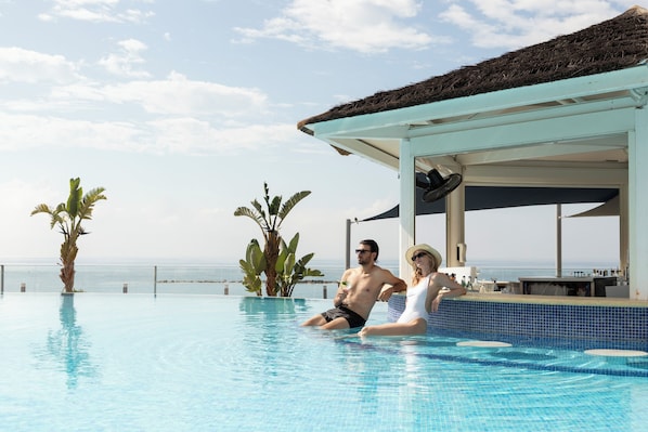 Indoor pool, outdoor pool, pool umbrellas, pool loungers