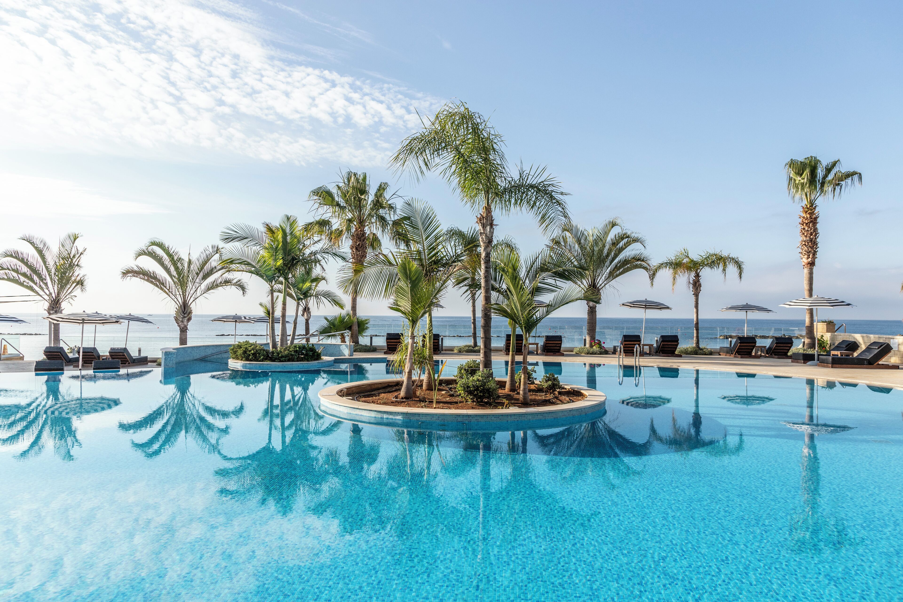 Indoor pool, outdoor pool, pool umbrellas, pool loungers