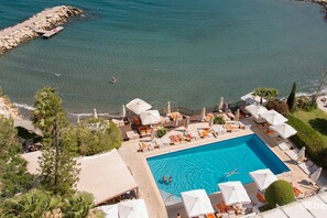 Outdoor pool, open 8 AM to 7 PM, pool umbrellas, pool loungers