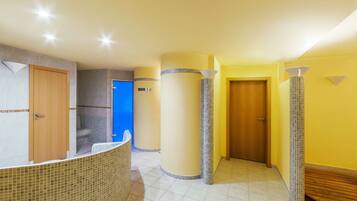 Welcome to our lobby, featuring a curved reception desk and stylish columns.