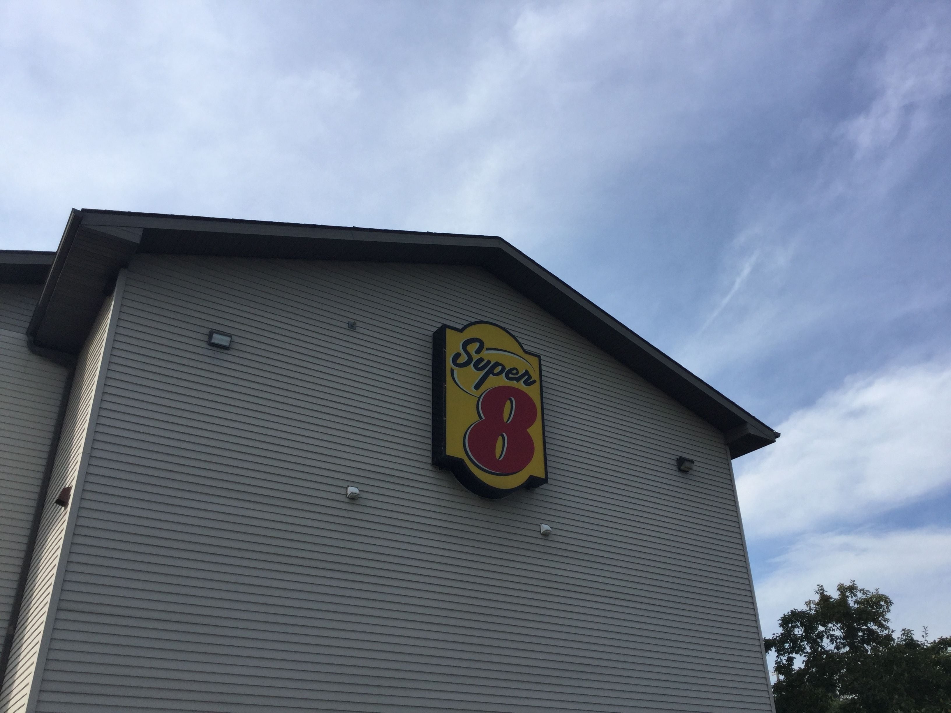 A building with a Super 8 sign on its facade.