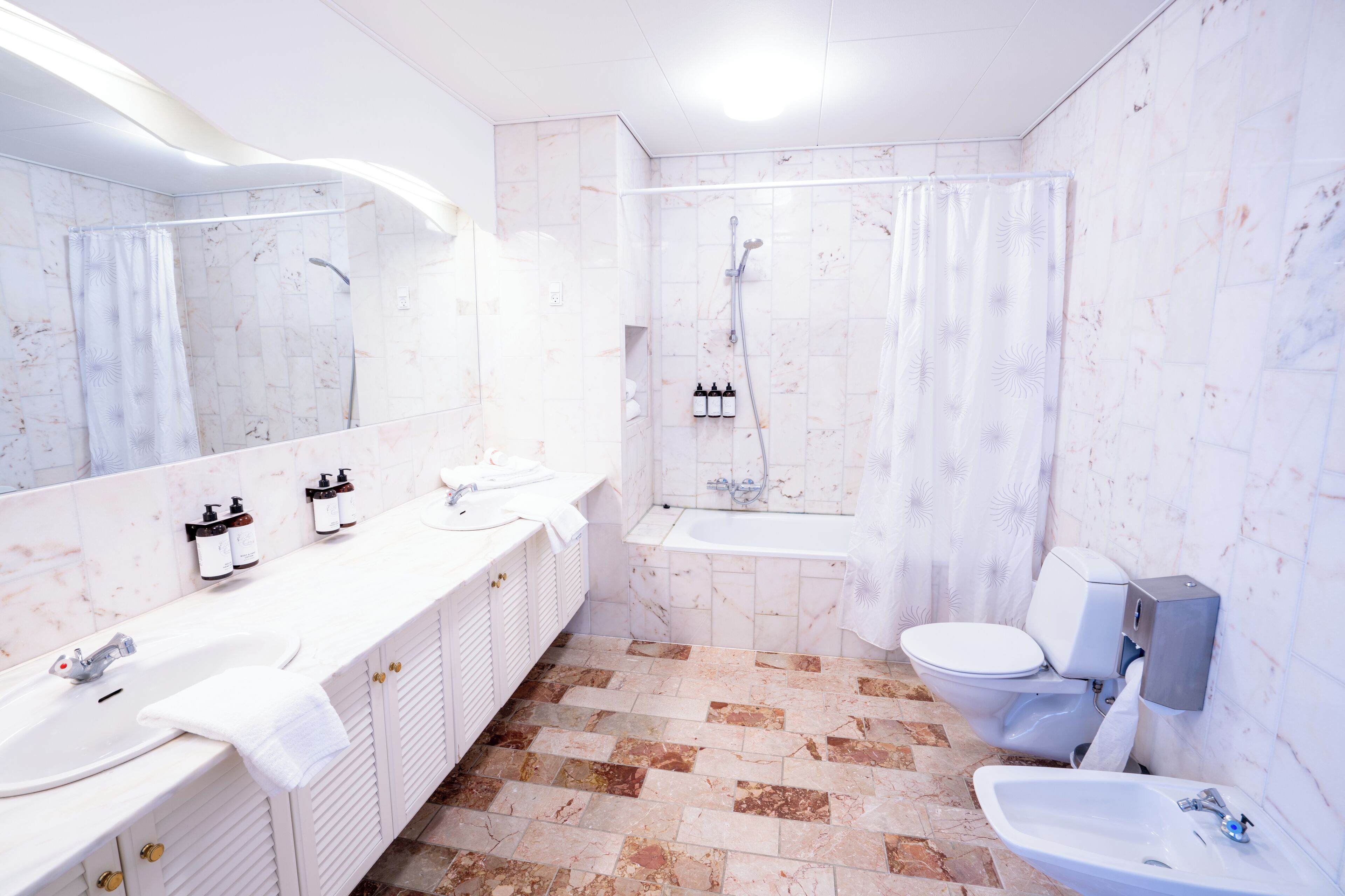 superior double room | bathroom | shower, free toiletries, hair dryer, towels