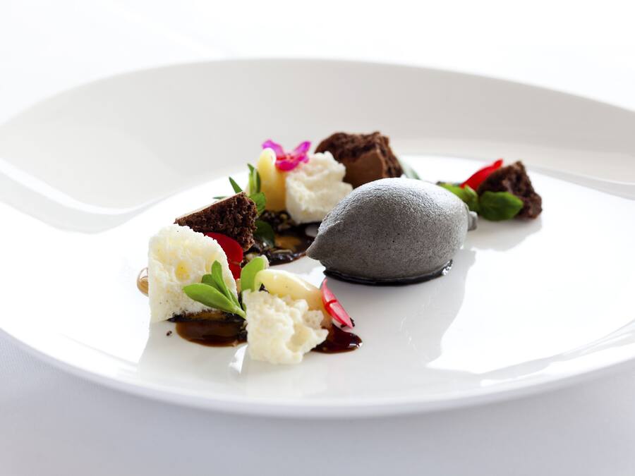 A white plate with various food items and garnishes.