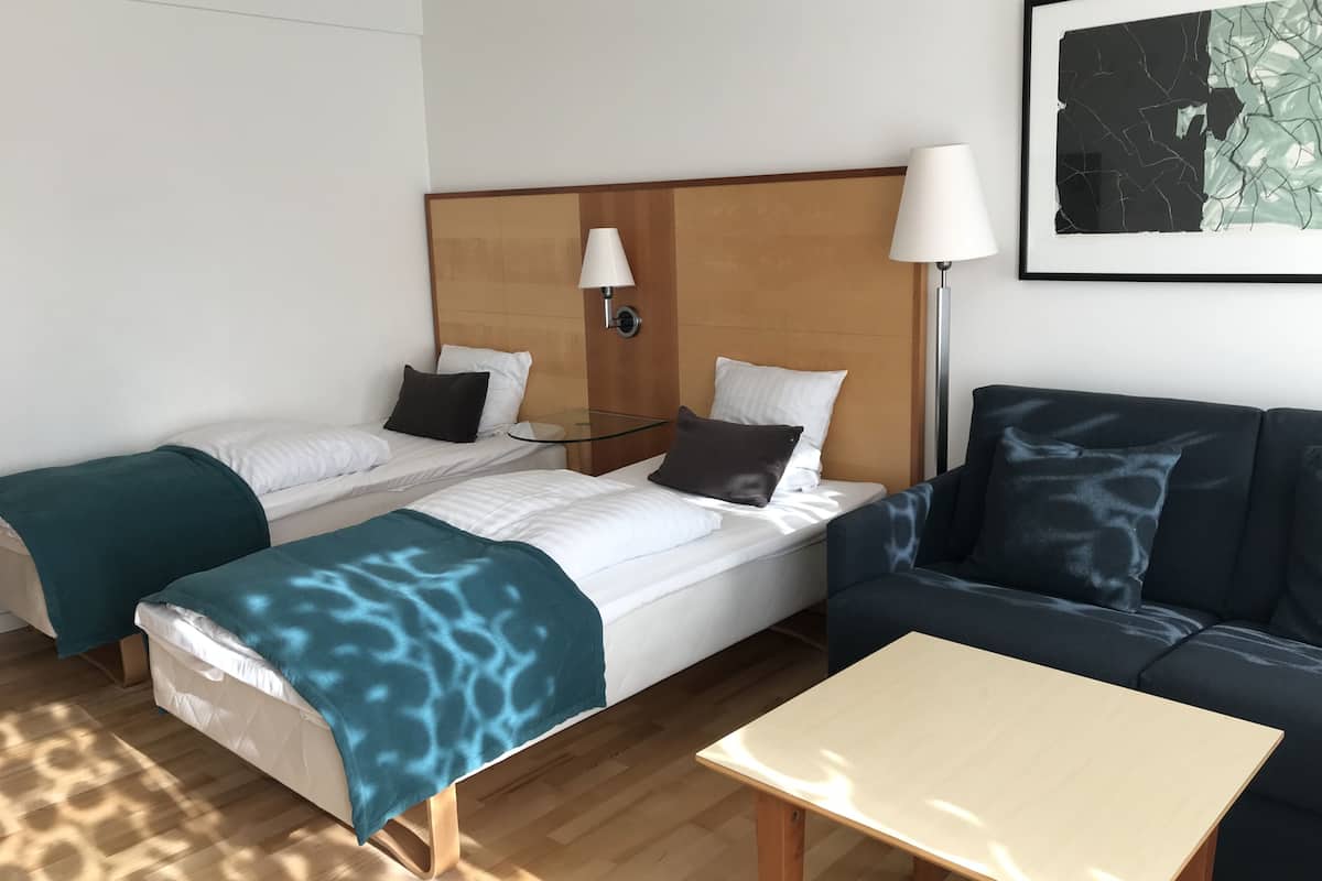 nordic room plus sleeping sofa | 1 bedroom, down duvets, desk, blackout curtains